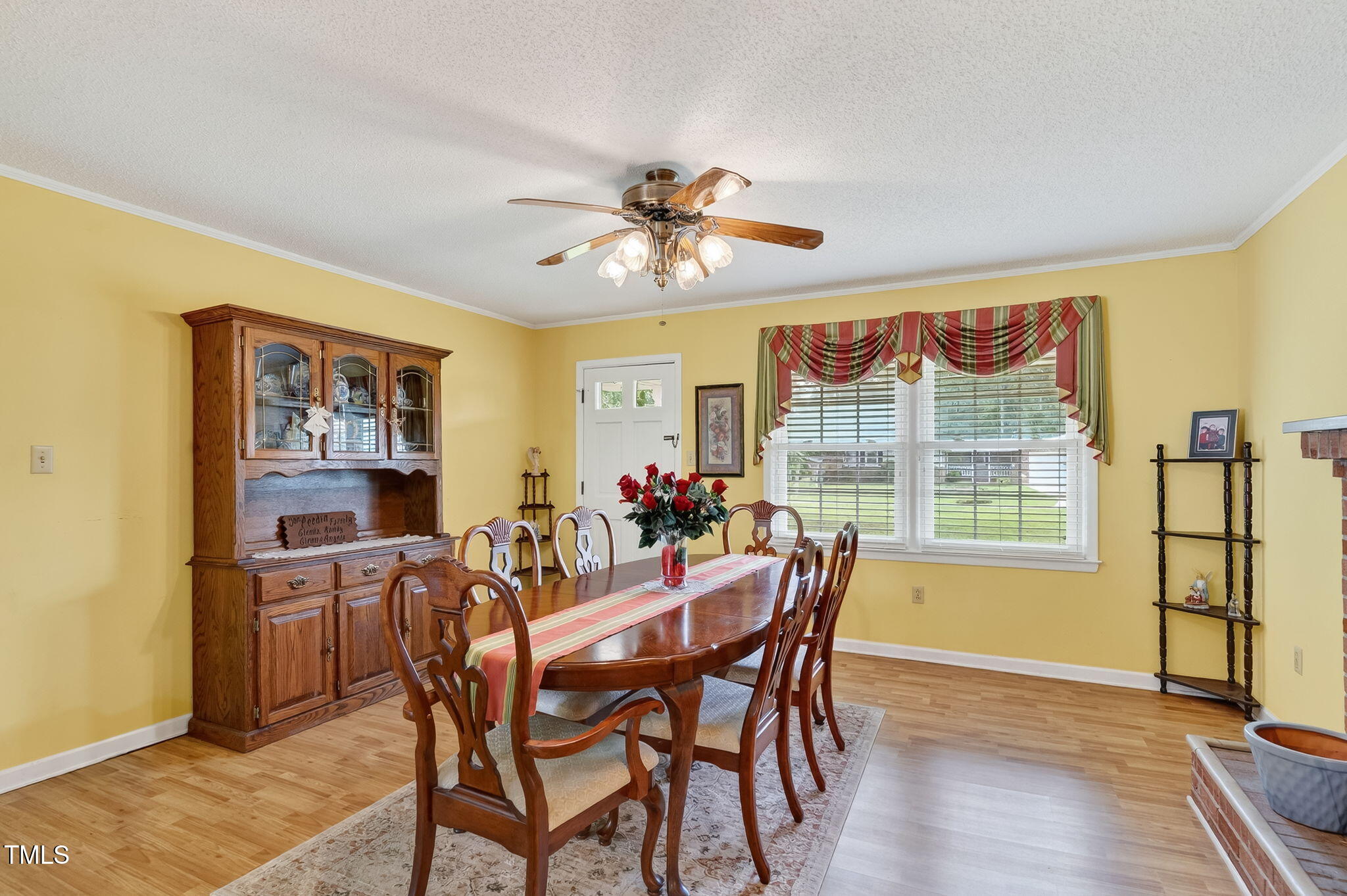 788 Gor An Farm Road Selma, NC 27576 - Photo 12 of 31 a view of a dining room with furniture large window and wooden floor