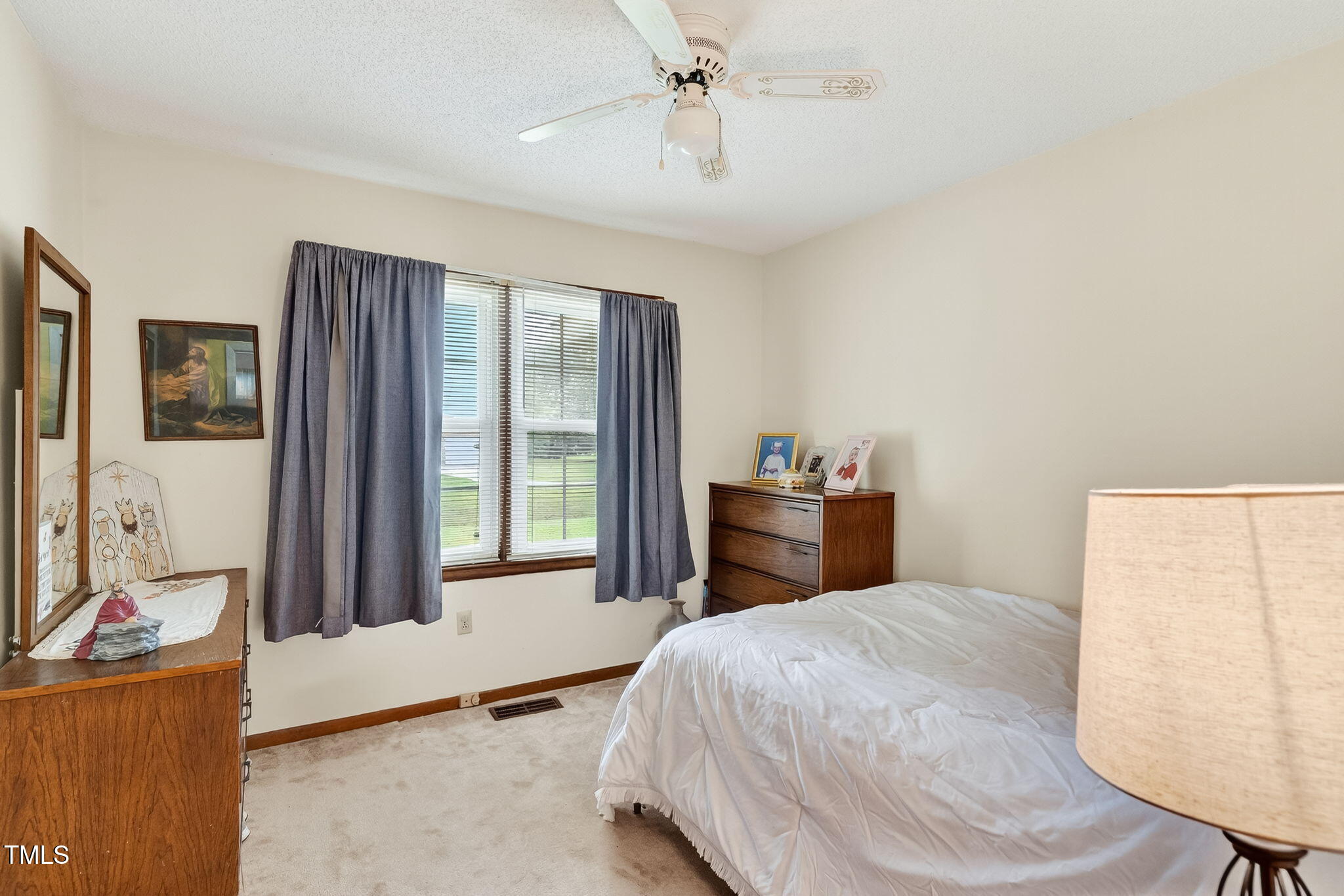788 Gor An Farm Road Selma, NC 27576 - Photo 14 of 31 a bedroom with a bed and a dresser