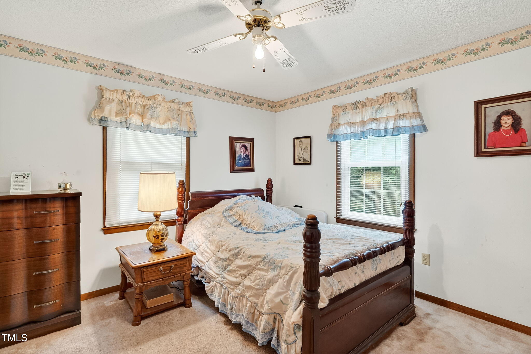 788 Gor An Farm Road Selma, NC 27576 - Photo 18 of 31 a bedroom with a bed and a chandelier