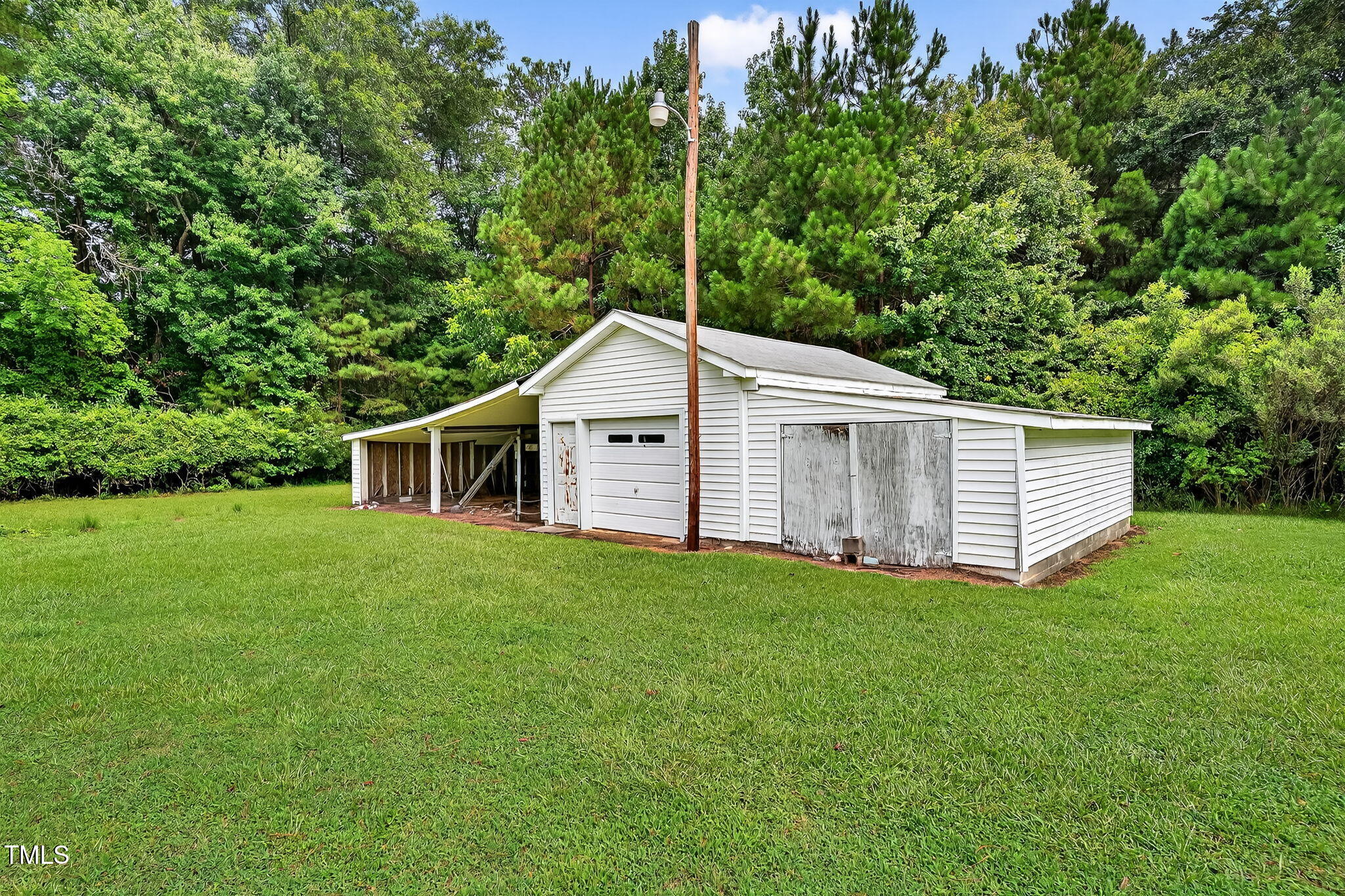 788 Gor An Farm Road Selma, NC 27576 - Photo 24 of 31 a house view with a garden space