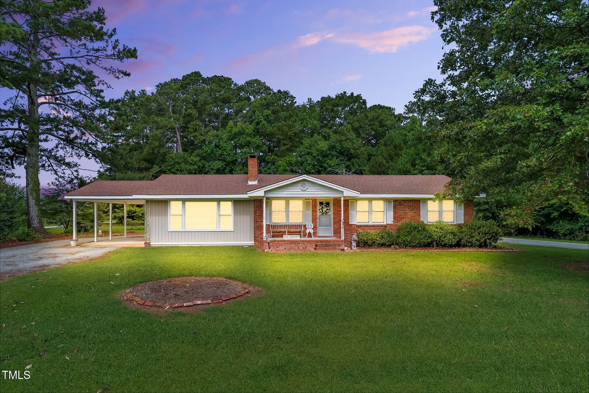 788 Gor An Farm Road Selma, NC 27576 - Photo 3 of 31 a front view of a house with a garden
