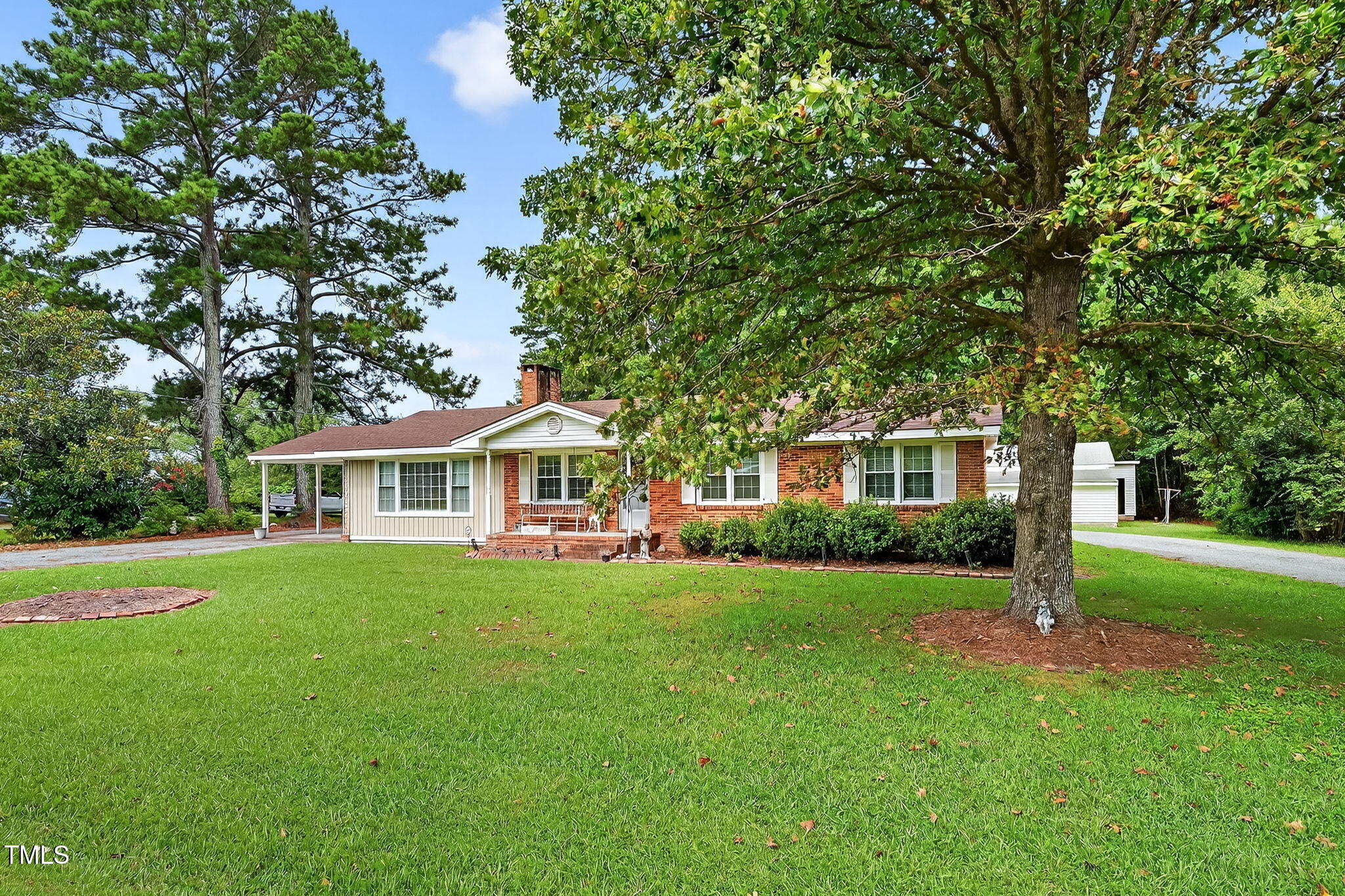 788 Gor An Farm Road Selma, NC 27576 - Photo 5 of 31 a front view of a house with a garden