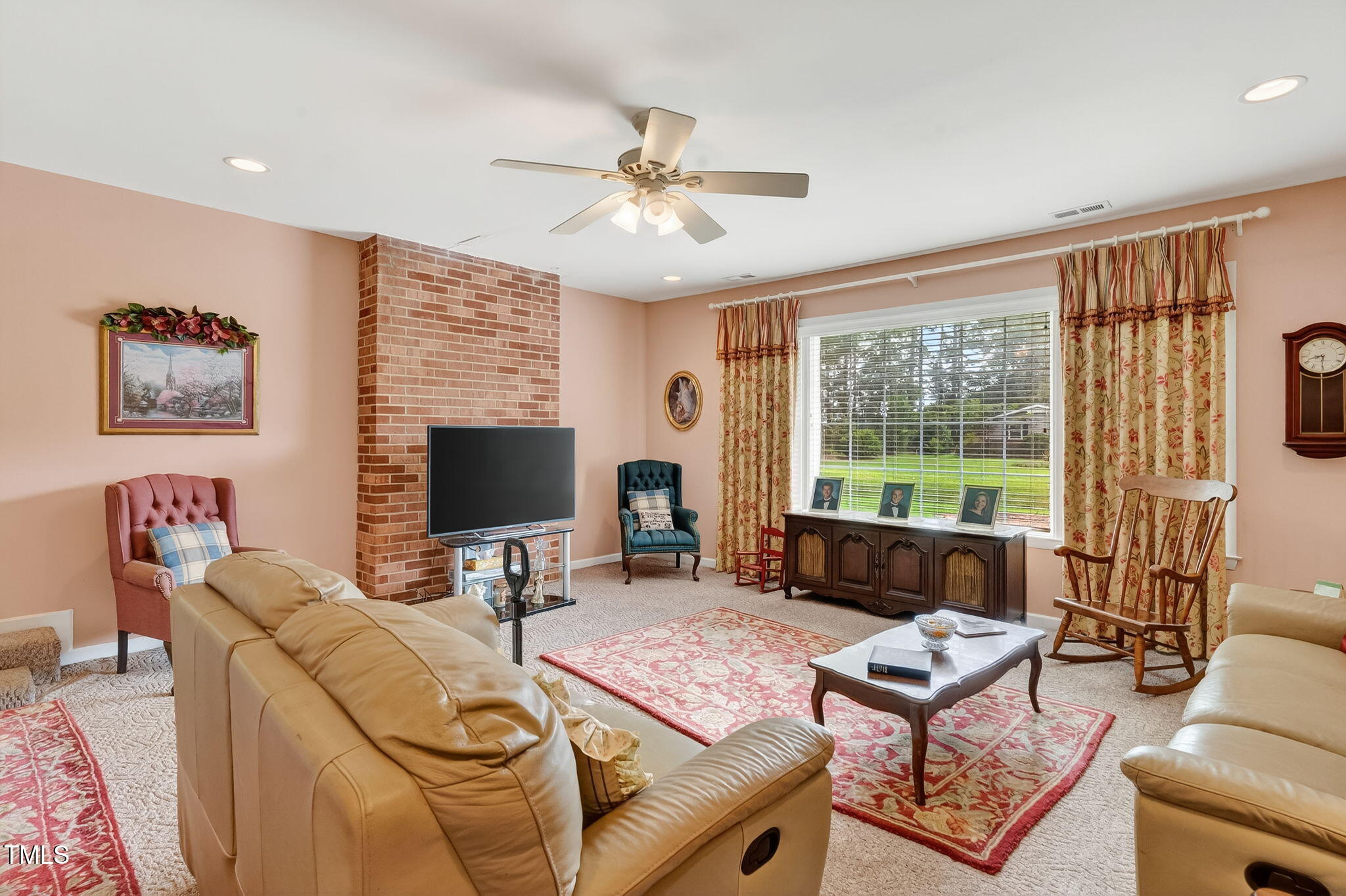 788 Gor An Farm Road Selma, NC 27576 - Photo 7 of 31 a living room with furniture a flat screen tv and a large window