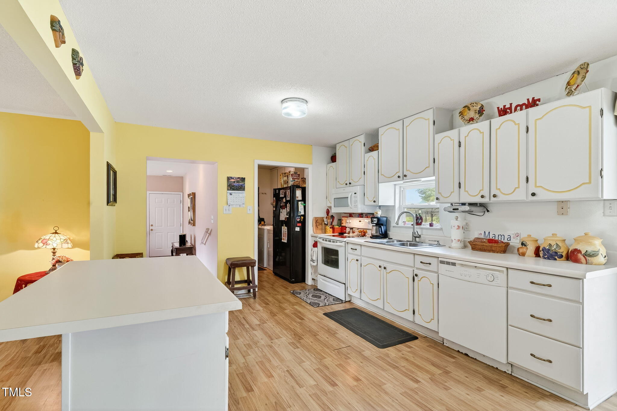 788 Gor An Farm Road Selma, NC 27576 - Photo 10 of 31 a kitchen with cabinets a sink and appliances