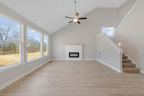 a view of an entryway with wooden floor