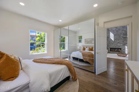 a bedroom with a large bed and a large window