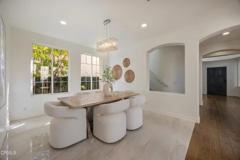 a very nice looking room with a large window and chandelier