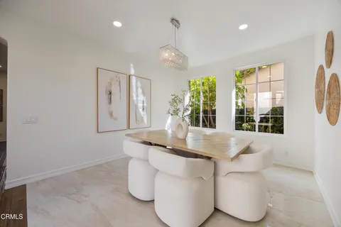 a lobby with furniture and floor to ceiling window