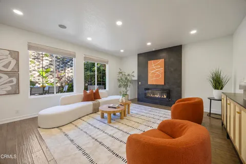 a kitchen with a sink cabinets and wooden floor