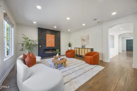 a kitchen with stainless steel appliances granite countertop a sink a stove and cabinets