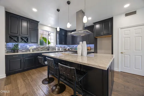 a view of hallway with chandelier