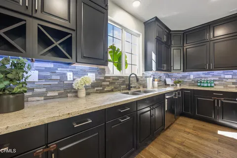 a bed room with a bed and a potted plant