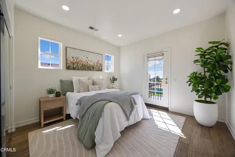a bathroom with a granite countertop sink a mirror and shower