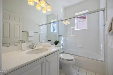 a bed room with a bed and a couch