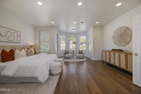 a bedroom with two beds and a couch