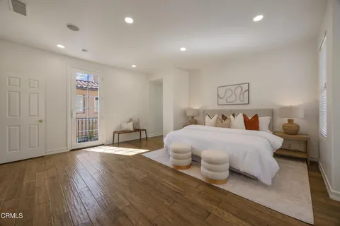 a view of a patio with table and chairs and potted plants