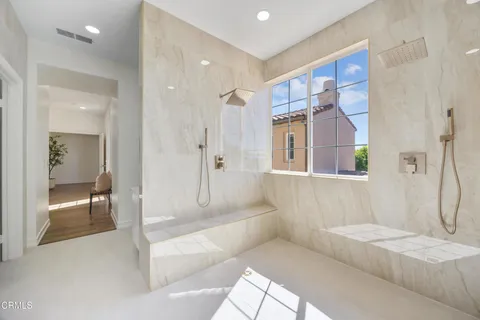 an aerial view of a house with garden space and swimming pool