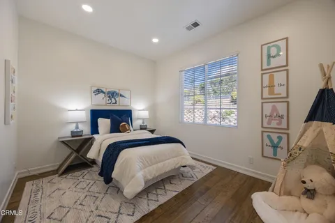 a palm tree sitting in front of a building