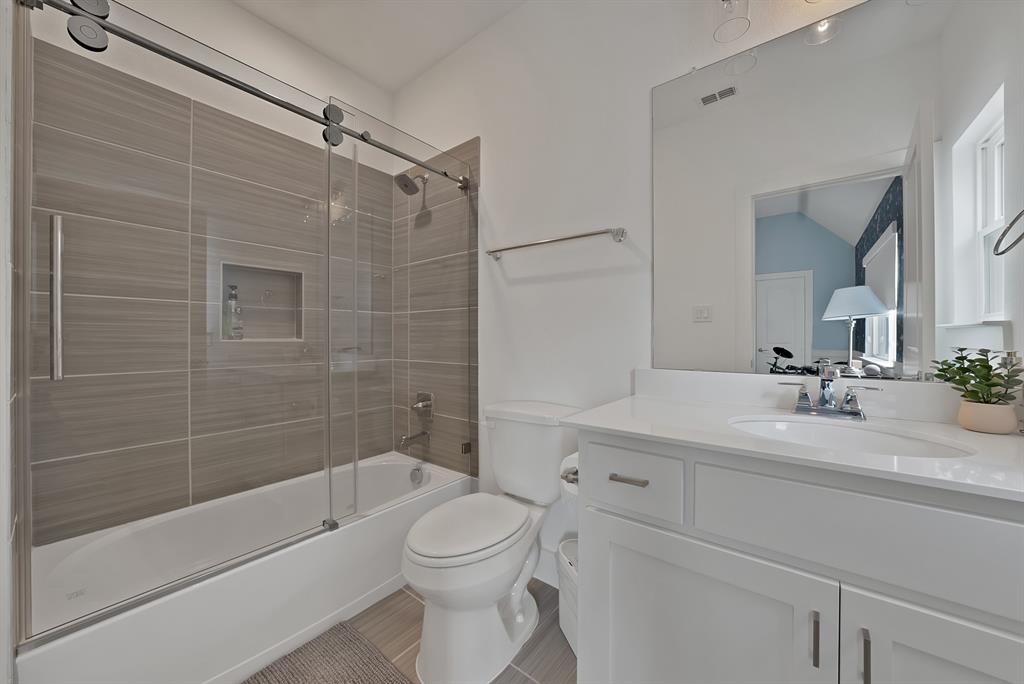 1010 Adair Road Prosper, TX 75078 - Photo 26 of 39 a bathroom with a sink a toilet and shower