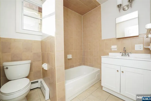 a bathroom with a sink a toilet and a bathtub