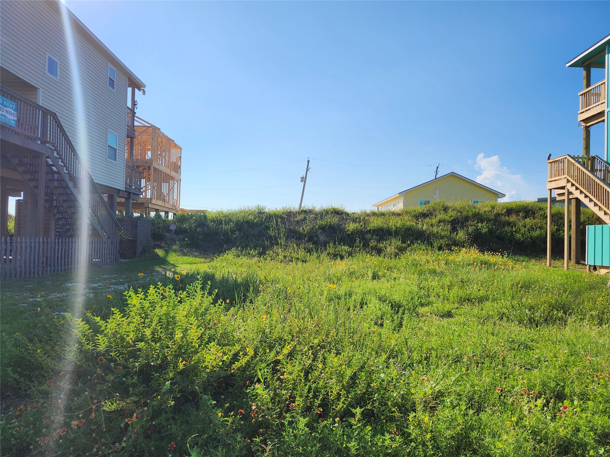 617 Wave Court Surfside Beach, TX 77541 - Photo 5 of 5 a view of a house with a yard