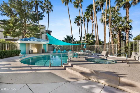 a front view of multiple houses with yard