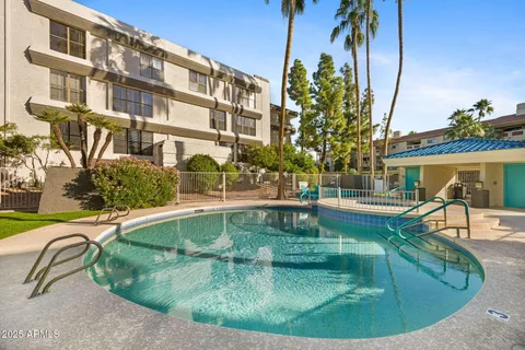 front view of a building with a garden