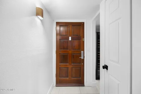 a living room with furniture a rug and a chandelier