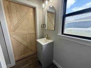 4308 43rd Street Lubbock, TX 79413 - Photo 11 of 18 a utility room with a sink a washer and dryer