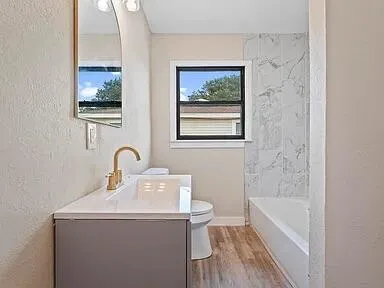a bathroom with a sink and a bathtub