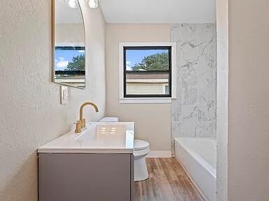 4308 43rd Street Lubbock, TX 79413 - Photo 12 of 18 a bathroom with a sink and a bathtub