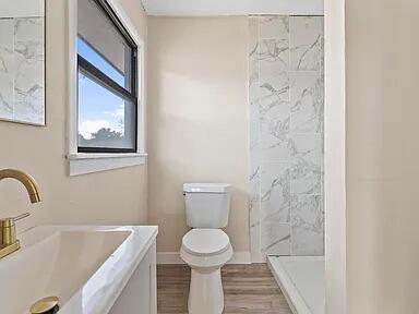4308 43rd Street Lubbock, TX 79413 - Photo 15 of 18 a bathroom with a sink and a toilet