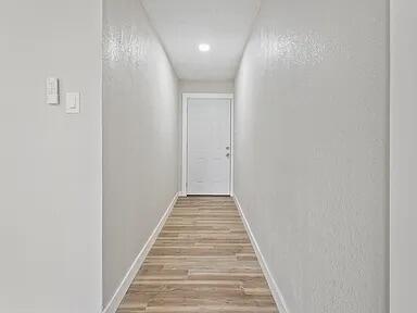 4308 43rd Street Lubbock, TX 79413 - Photo 2 of 18 a view of a hallway with wooden floor