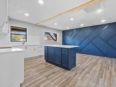 4308 43rd Street Lubbock, TX 79413 - Photo 5 of 18 a view of a kitchen with wooden cabinet and a window
