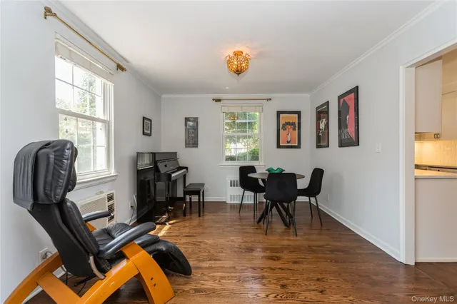 a view of a dining room with furniture window and wooden floor