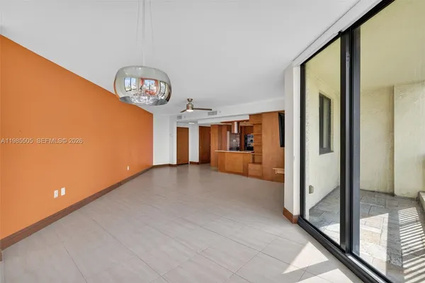 a view of an empty room with a window