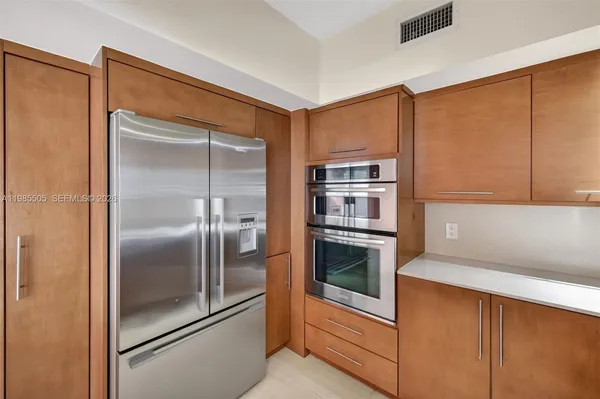 a en suite bathroom with a toilet sink and mirror