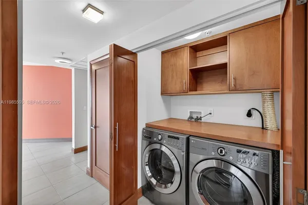 a bedroom with a bed and a tv