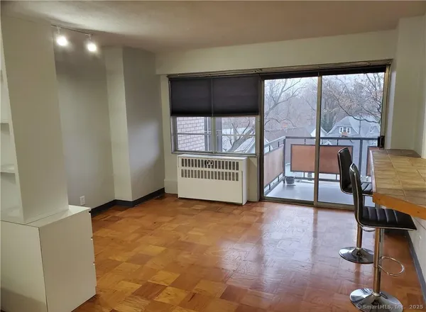 a view of an empty room with a window