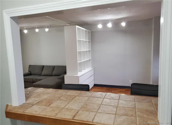 a living room with a couch and cabinets