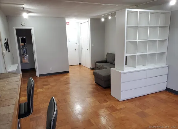 a room with furniture and a flat screen tv