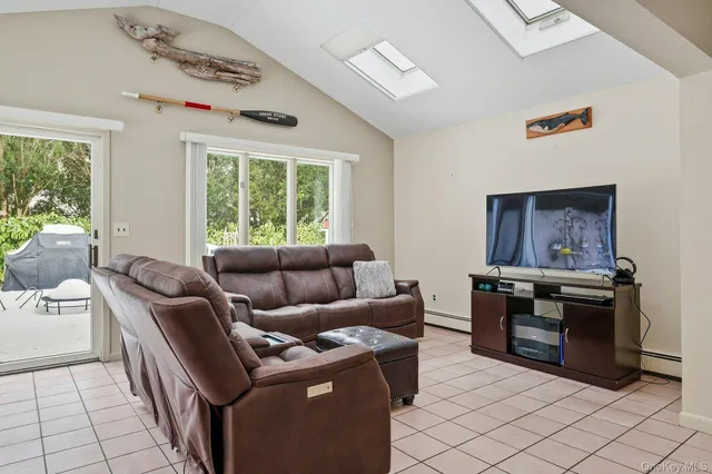 a living room with furniture and a window