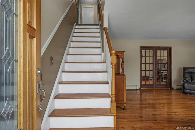 a view of staircase with white walls and windows