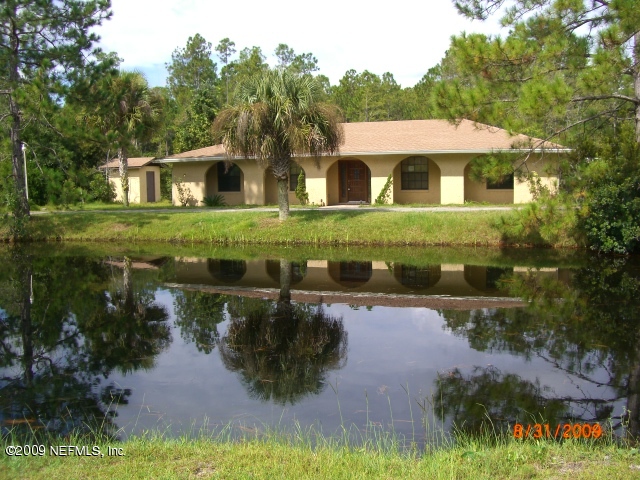 2415 Pacetti Road St. Augustine, FL 32092 - Photo 1 of 9 Front of House with view of Pond
