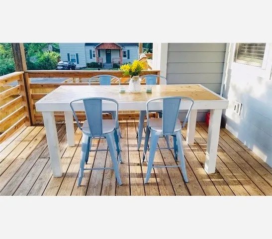 a view of a dining tables and chairs in the patio