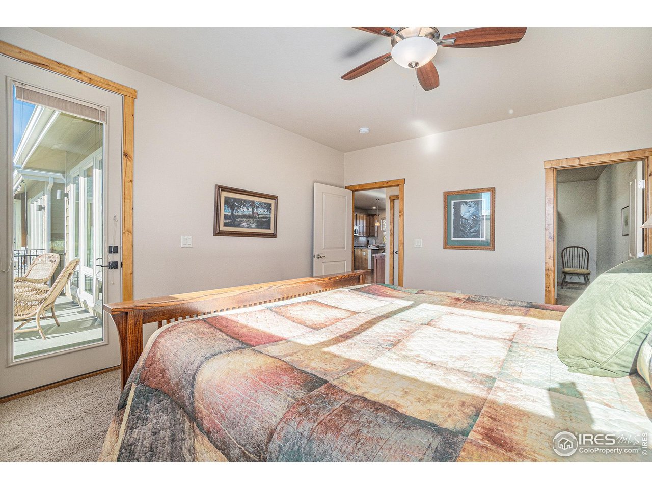 1827 Fromme Prairie Way Fort Collins, CO 80526 - Photo 11 of 21 a bedroom with a bed and wooden floor