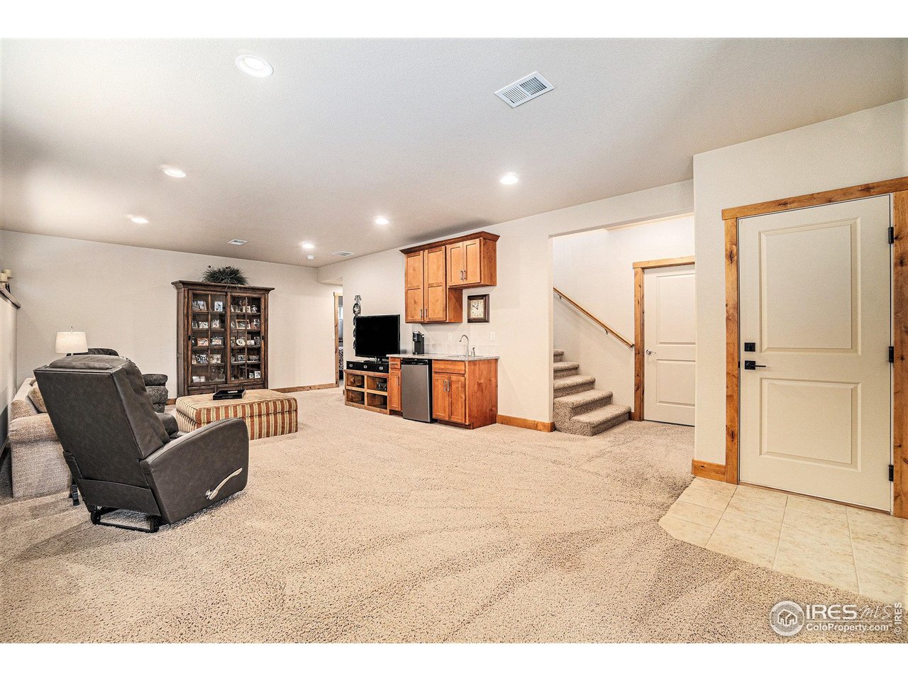 1827 Fromme Prairie Way Fort Collins, CO 80526 - Photo 15 of 21 a view of a living room kitchen and a refrigerator