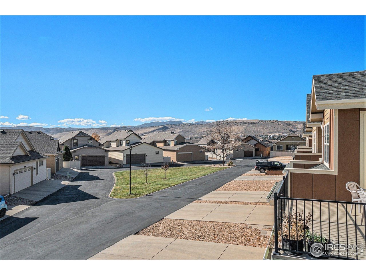 1827 Fromme Prairie Way Fort Collins, CO 80526 - Photo 19 of 21 a view of a terrace with a table and chairs