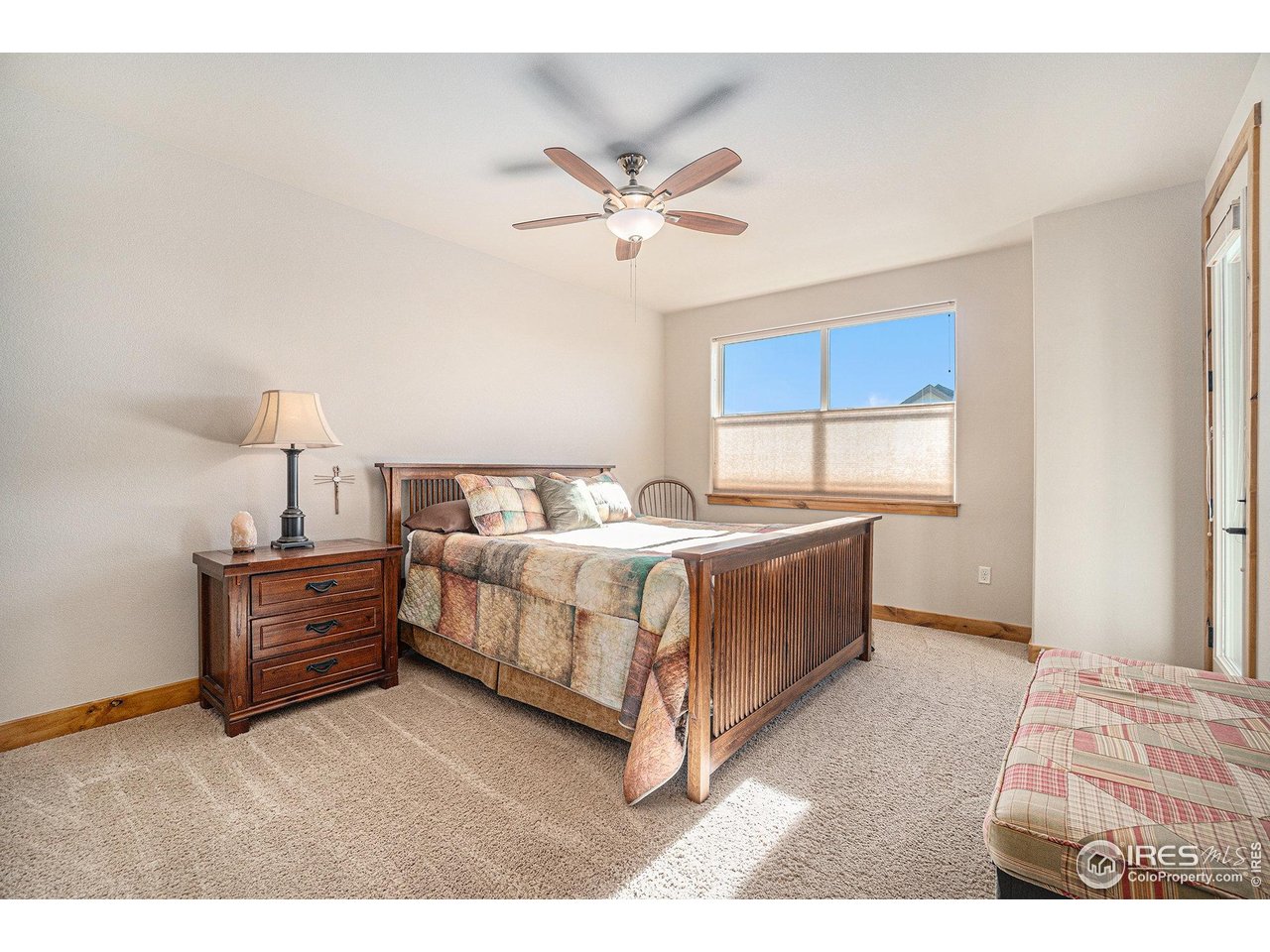 1827 Fromme Prairie Way Fort Collins, CO 80526 - Photo 10 of 21 a bedroom with a bed and a window