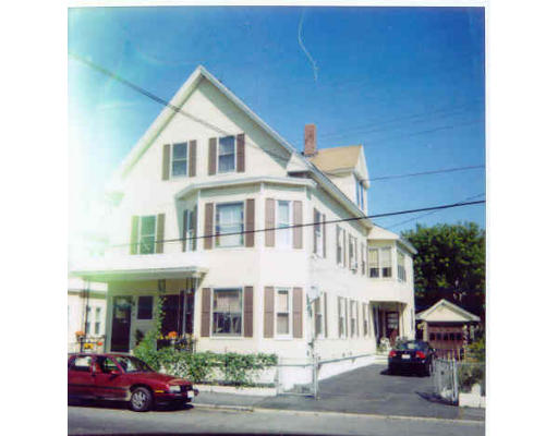 a front view of a residential houses with yard